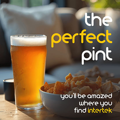 A filled glass of beer on a table